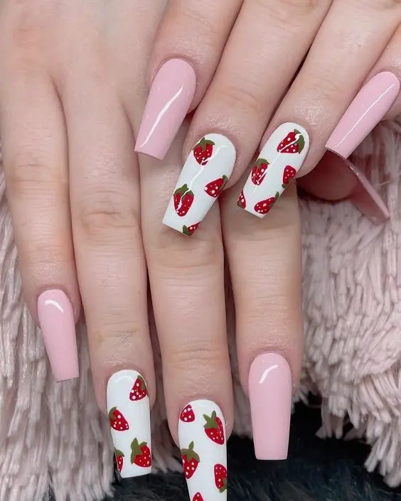 Long ballerina-shaped nails combine soft pink and vivid white, detailed with realistic strawberry illustrations. The striking contrast between the colors gives a fresh, youthful vibe, making it a perfect choice for seasonal fashion statements.