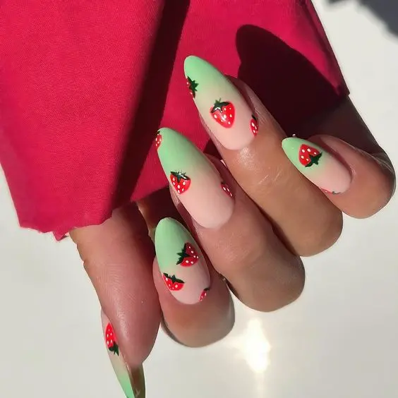 These nails feature a fresh mint green base with miniature strawberry designs, offering a light, airy feel. The subtle pink base enhances the vivid red strawberries, making this set ideal for a casual spring outing.