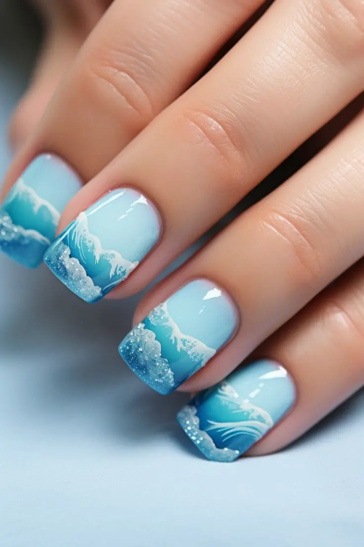 These square-shaped nails feature a tropical beach theme with a gradient turquoise base. Accented with ocean waves, this design captures the essence of summer\'s serenity and relaxation.