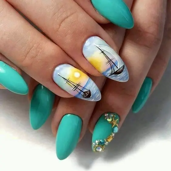 Stiletto nails with a sunset beach scene, showcasing sailboats and a sparkling turquoise sea. The vibrant colors and intricate details capture the essence of a summer evening by the water.