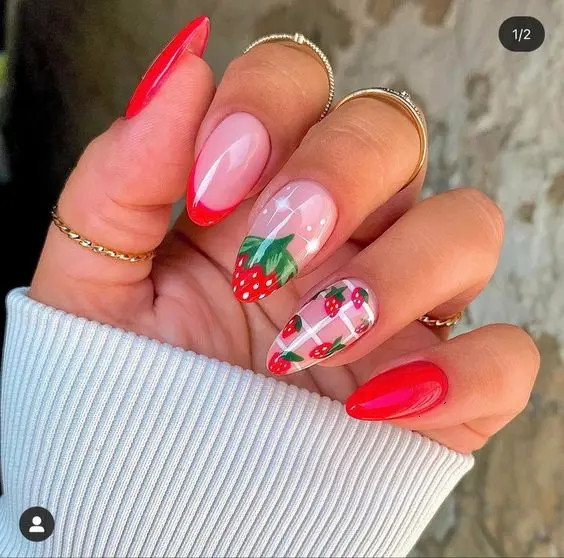 Bold and bright, this set showcases shiny candy apple red nails mixed with strawberry accents over a clear background, perfect for making a summery statement.