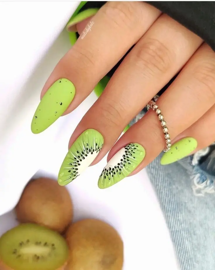 Lime green nails with kiwi fruit accents bring a refreshing twist to summer fashion, merging playfulness with a pop of vibrant color.