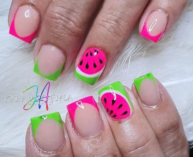 Square nails combine clear pink with bright neon green tips, accented by a charming watermelon slice design, embodying a playful summer essence.