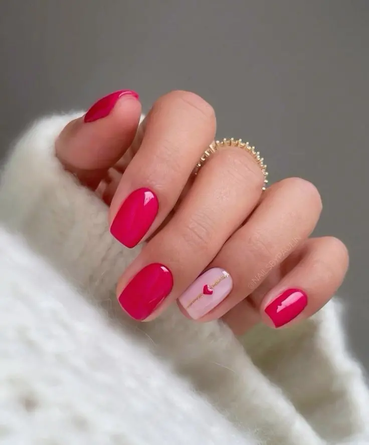 These nails combine a bold red polish with a minimalist heart design on nude bases. The square shape and high-gloss finish create a sophisticated look, ideal for expressing love and passion in a subtle yet stylish manner.