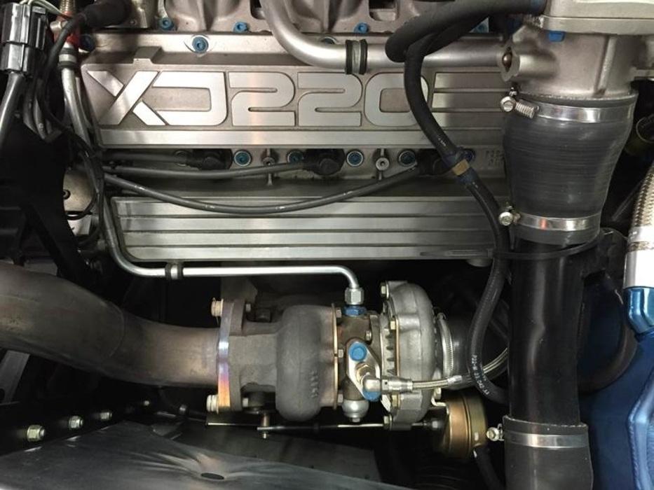 Power comes from a twin-turbo V6, not the V12 initially promised