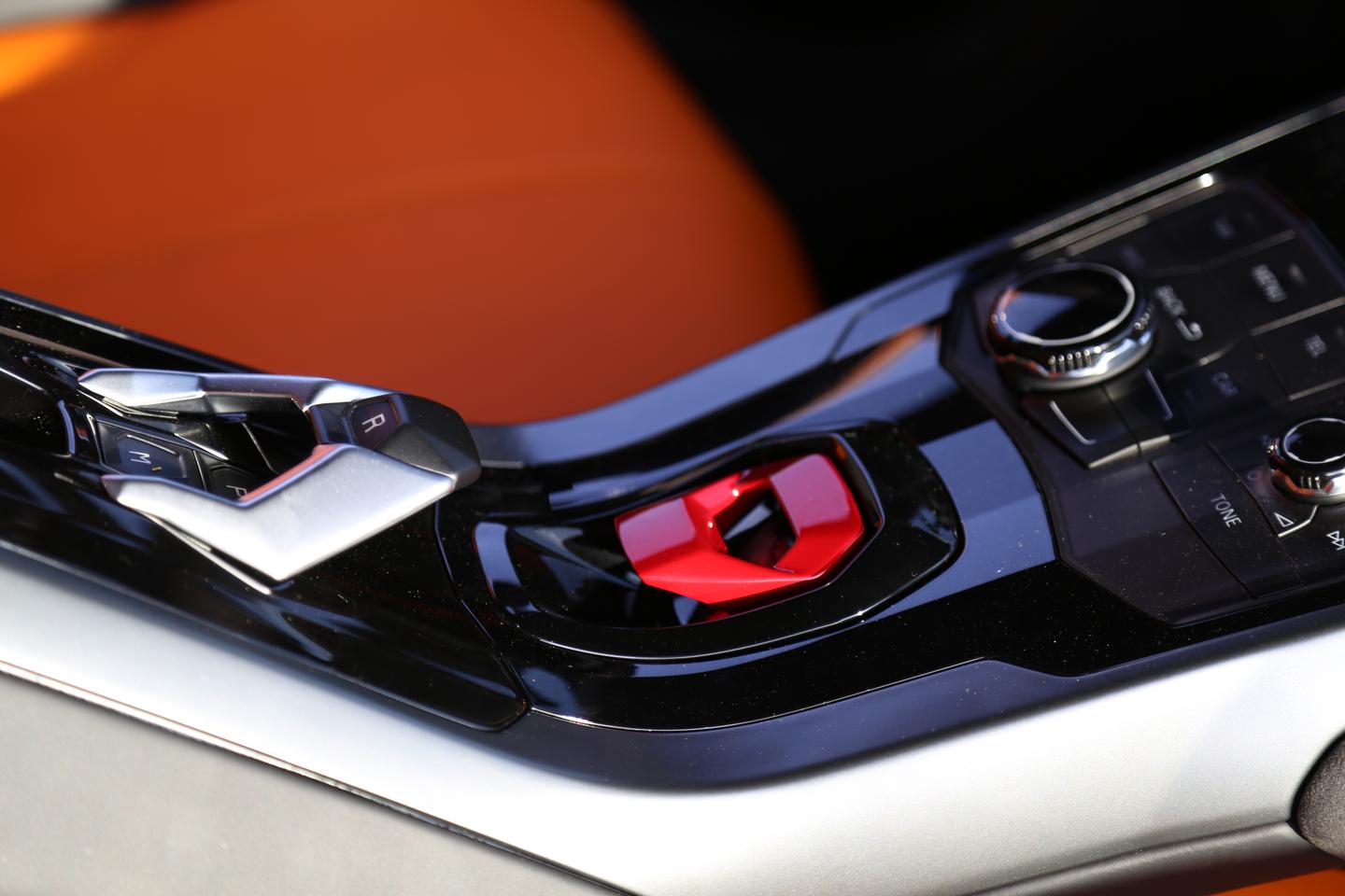 Just like the Aventador, the Huracán features the gimmicky but still very cool red metal ignition switch cover (Photo: Angus MacKenzie/Gizmag.com)